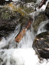 Scenic view of river flowing through rocks