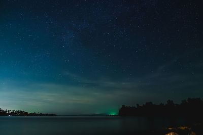 Scenic view of lake against star field at night