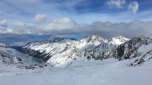 Scenic view of snowcapped mountains against sky