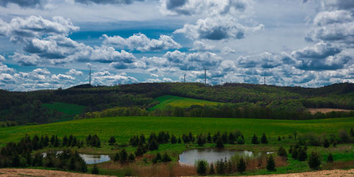 Scenic view of landscape and lake against sky