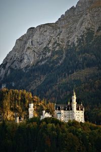 Buildings against mountain range