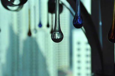 Close-up of decoration hanging against window