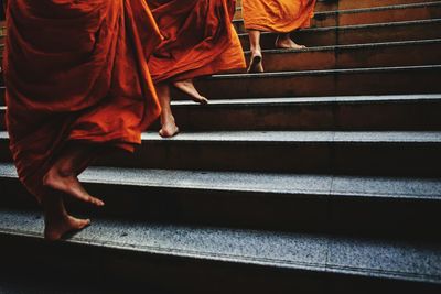 Monks climbing stairs