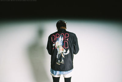 Rear view of man standing outdoors