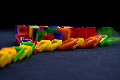 Close-up of multi colored dominoes on table