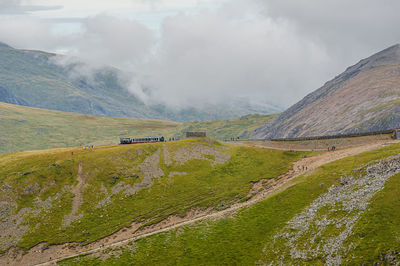 View from ranger path at llanberis path and mountain train to yr wyddfa peak - snowdon in wales. uk.