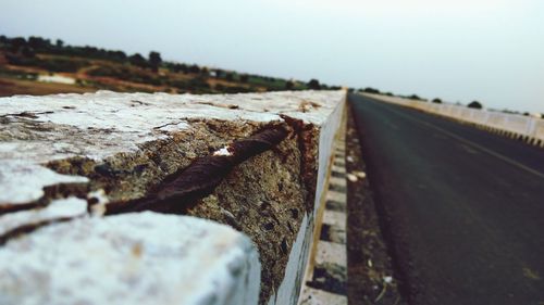 Close-up of railroad track against clear sky