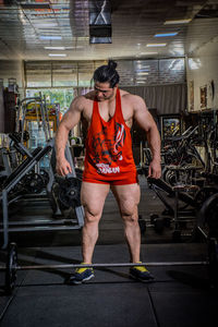 Bodybuilder standing in gym