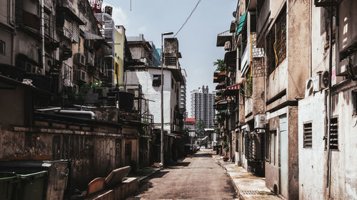 Narrow alley amidst buildings in city