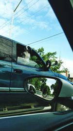 Close-up of car against sky