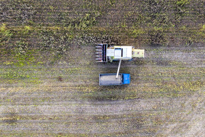 High angle view of old abandoned car on field