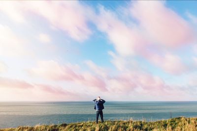 Rear view of man standing on beach