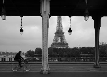 Man hanging on bicycle in city