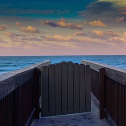 Pier against sea and sky during sunset