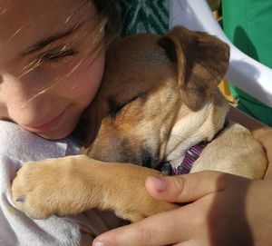 Close-up of woman with dog