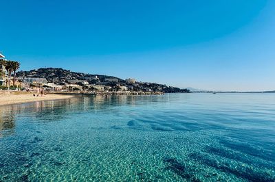 Scenic view of sea against clear blue sky