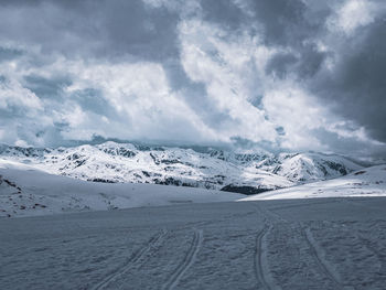 Scenic view of snowcapped mountains against sky