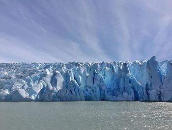 Panoramic view of frozen sea against sky