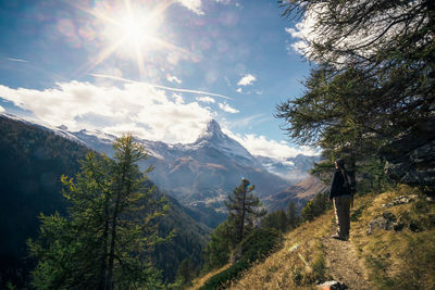 Scenic view of mountains against bright sun