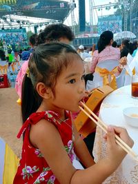 Girl eating food at event