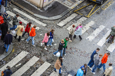 High angle view of people walking on city street