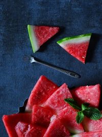 High angle view of melon slices on table