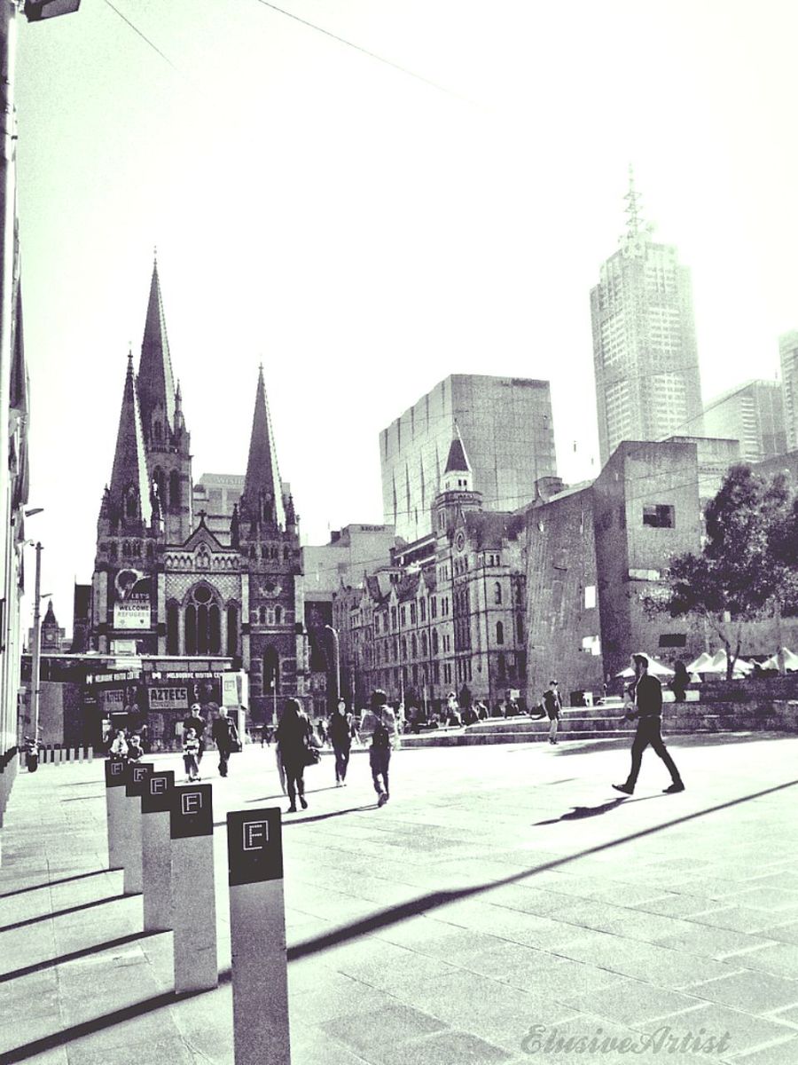 CITY STREET AGAINST SKY