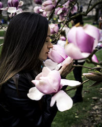 Close-up of woman with pink flowers