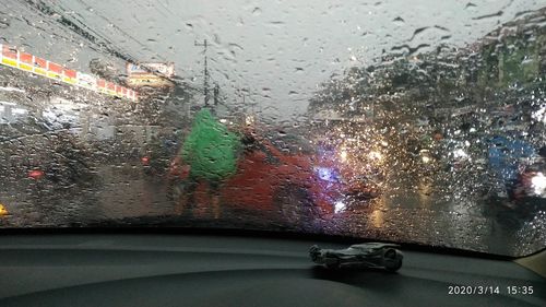 Raindrops on glass window of car