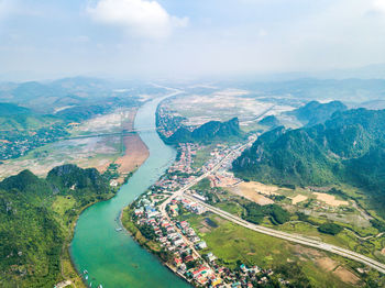 High angle view of river amidst landscape against sky