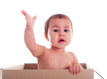 Portrait of cute boy against white background