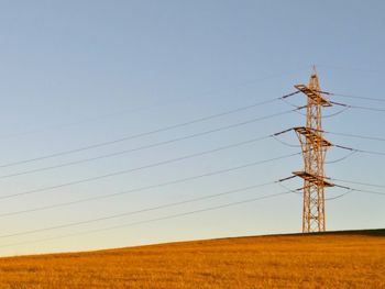 Electricity pylon on field