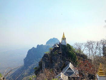 Panoramic view of building and mountains against sky