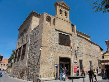 Low angle view of historical building against clear blue sky