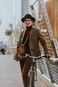 Portrait of young man riding bicycle