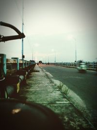 Empty road against sky