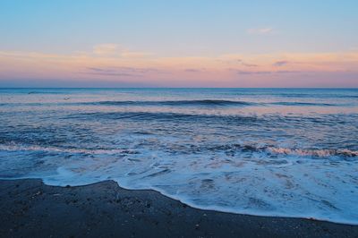 Scenic view of sea at sunset