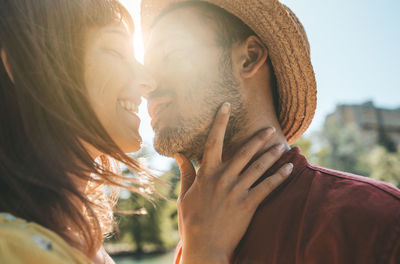 Close-up of romantic couple during sunny day
