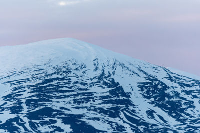 Scenic view of mountain against clear sky during winter