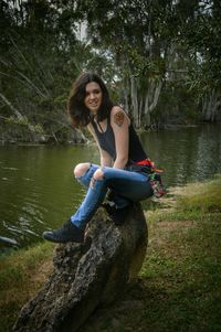 Young woman sitting in lake