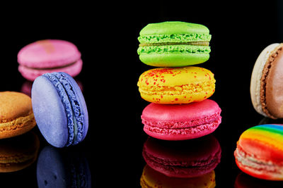 Close-up of macaroons against black background