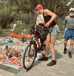 People riding bicycle on road