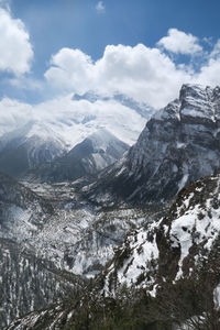 Scenic view of snowcapped mountains against sky