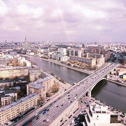 High angle view of cityscape against cloudy sky