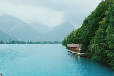 Scenic view of lake and mountains against sky