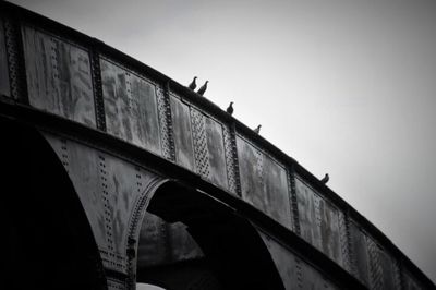 Low angle view of bridge against clear sky