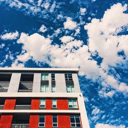 Low angle view of building against cloudy sky