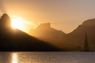 Scenic view of silhouette mountains against sky during sunset