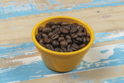 Close-up of roasted coffee beans on table