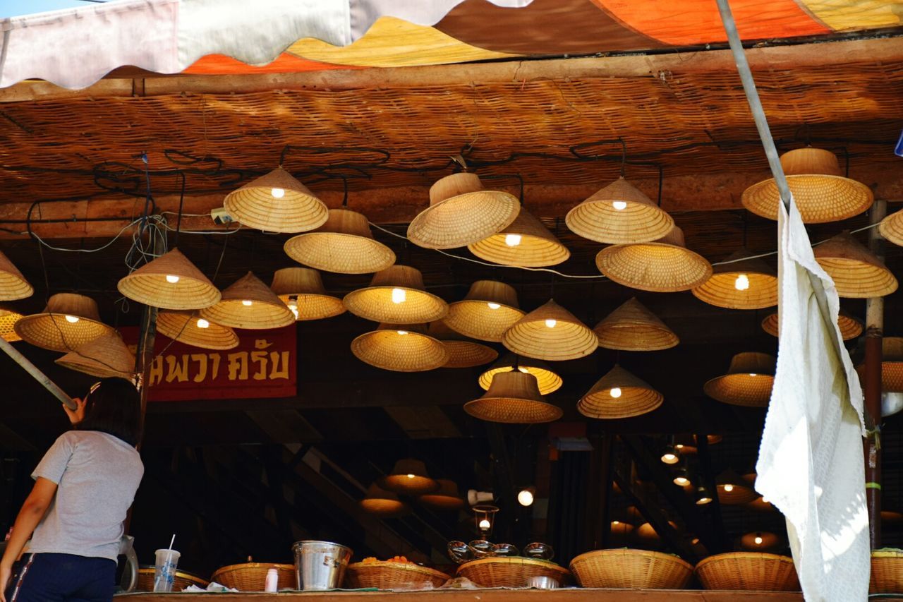 LOW ANGLE VIEW OF ILLUMINATED LANTERNS HANGING AT RESTAURANT